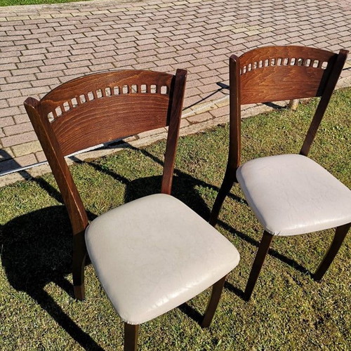Wooden chair used with beige leather seat dark brown