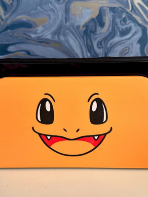 Nintendo Switch 2 dock cover with 3D Charmander design