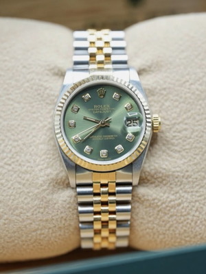 Rolex Datejust 31 with custom diamond dial and gold steel jubilee bracelet like new