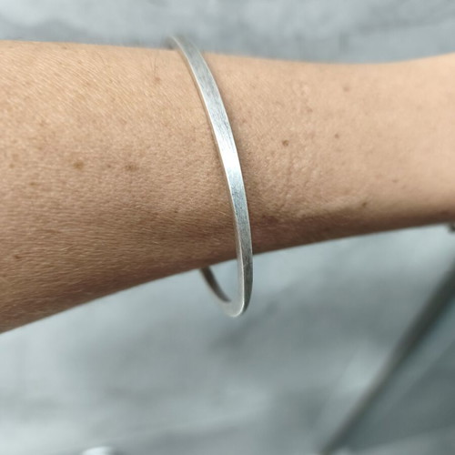 Brass bangle bracelet with matte silver finish
