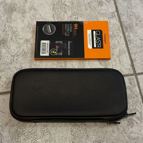 Nintendo Switch protection set used with original carrying case and Spigen tempered glass