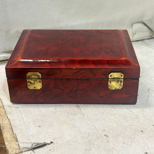 Vintage wooden jewelry box used with red satin lining