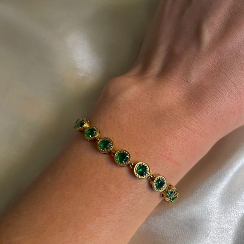 Riviera stainless steel bracelet new with green stones in gold color