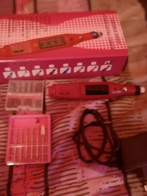 Electric nail file used with drill bits