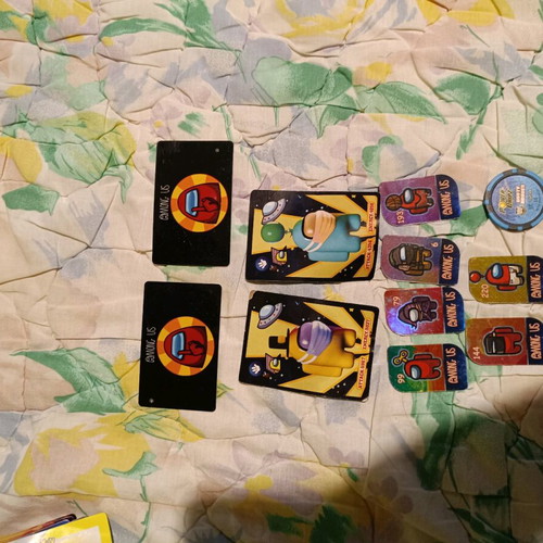 Among Us used 6 metal tokens, 2 cards, 2 papers