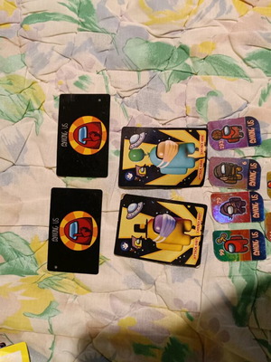 Among Us used 6 metal tokens, 2 cards, 2 papers