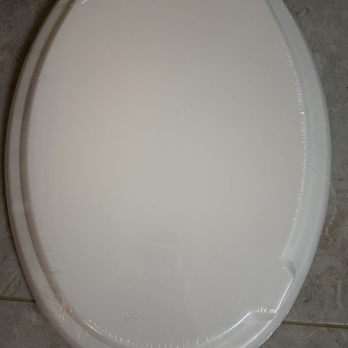 Toilet seat new, white oval shape