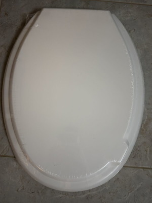 Toilet seat new, white oval shape