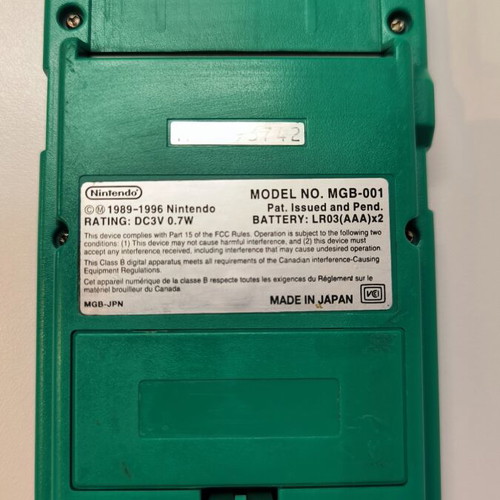 Game Boy Pocket Green console used with Test Drive 6 game