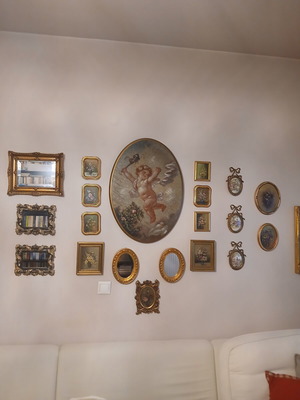 Various small framed paintings and mirrors