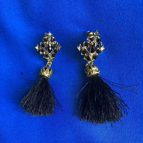 Gold and black earrings with tassel