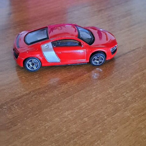 Toy car used, red color