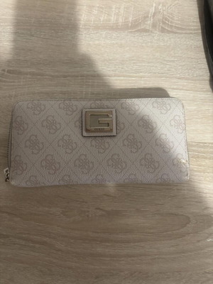 Guess wallet used, white and beige, zipper needs replacement