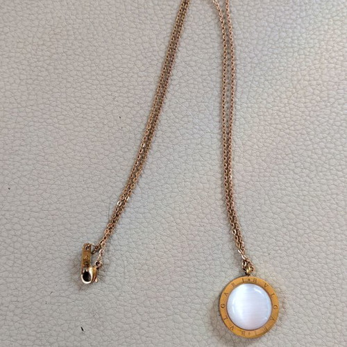 Gold necklace pendant with iridescent white stone, like new