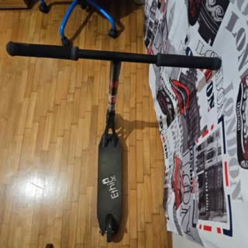 Scooter used for tricks with Ethic Vulcain 530 deck