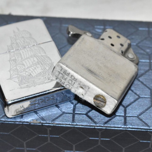 Zippo chrome lighter with sailboat design used