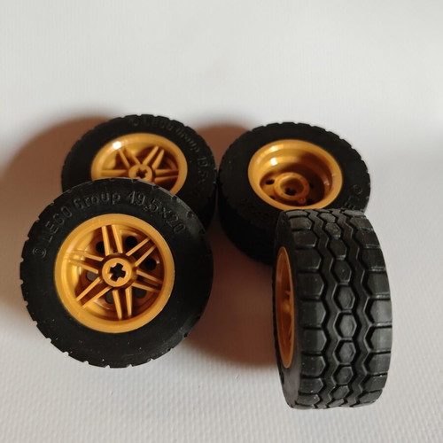 Lego wheels set of 4 with brown rims like new