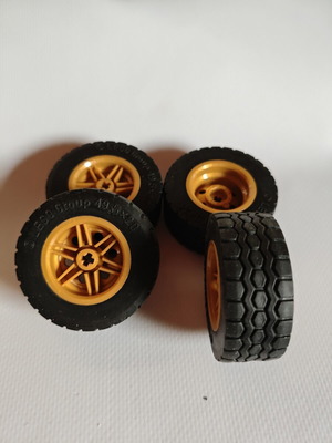 Lego wheels set of 4 with brown rims like new