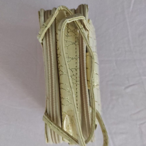 Small gold wristlet shoulder bag