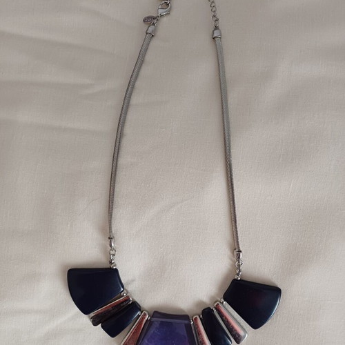 Geometric necklace used with blue and purple designs, Marks & Spencer
