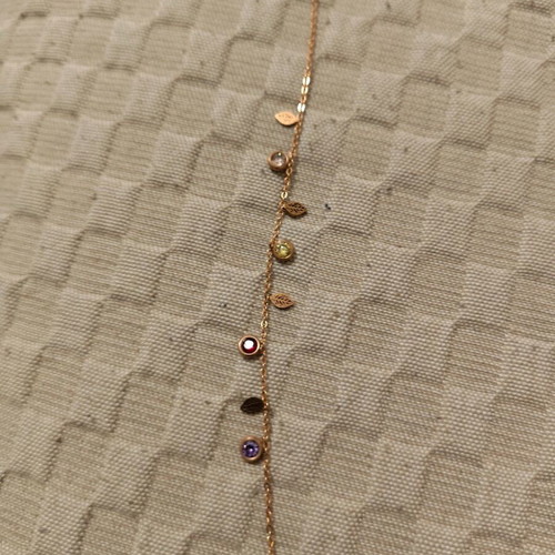 Steel bracelet gold color like new with red and white stones