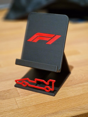 F1 phone stand like new, ideal for any mobile device