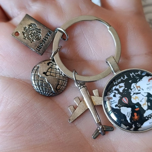 Travel keychain with world map design