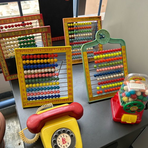 Vintage toys used, 1970s abacus counters, plastic phone