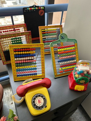 Vintage toys used, 1970s abacus counters, plastic phone