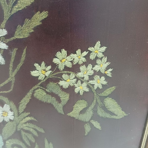 Embroidered textile painting used with silver and gold thread on velvet