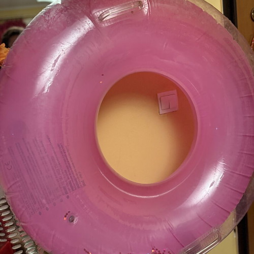 Pink inflatable pool float with glitter