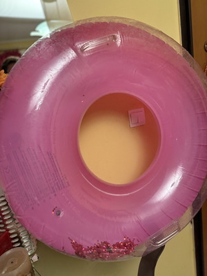 Pink inflatable pool float with glitter