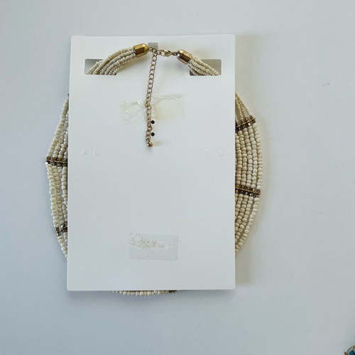 Wide necklace like new with beige and gold beads and metal details