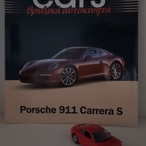 Porsche 911 Carrera S collectible model and booklet like new