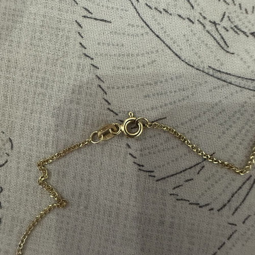 14k gold cross pendant with 9k long chain, reversible design