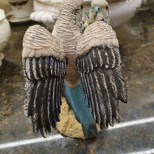 Figurine of two beautiful parrots on a branch like new