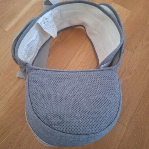 Gabesy ergonomic hip seat carrier used with branded baby toys