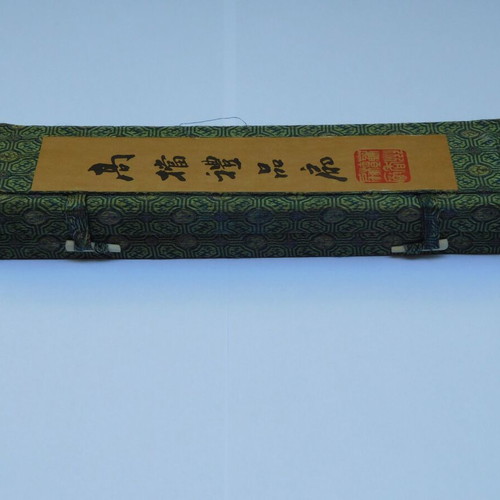 Traditional Chinese sandalwood fan with decorative tassel