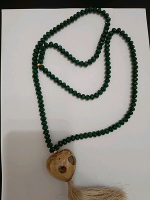 Necklace like new with green beads and large heart