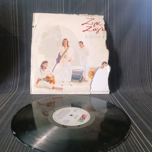 Zig-zag Ainigma used vinyl with cover damage