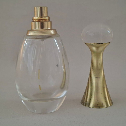 Roberto Cavalli Oro and Christian Dior J'adore empty perfume bottles