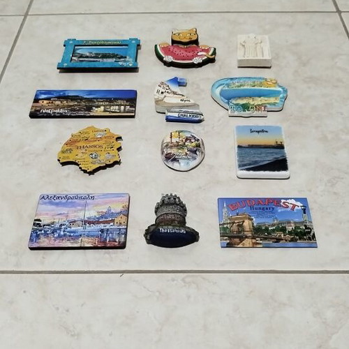Set of 12 souvenir fridge magnets from various regions