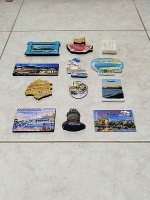 Set of 12 souvenir fridge magnets from various regions
