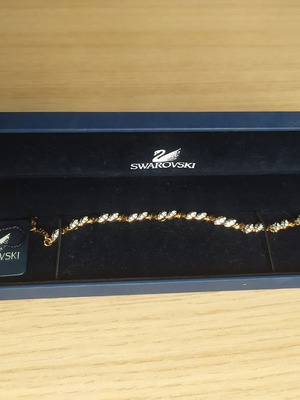 Swarovski bracelet like new, gold tone with crystals