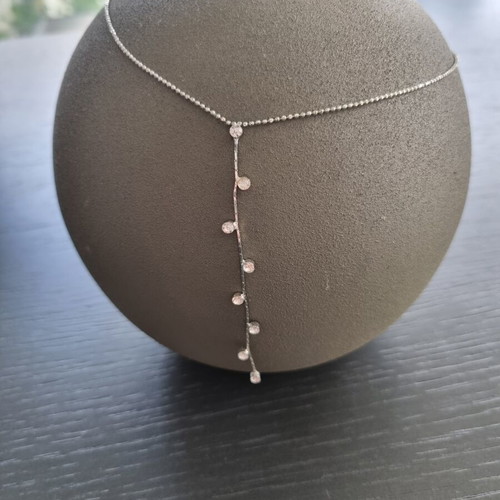 Necklace with hanging chain and stones