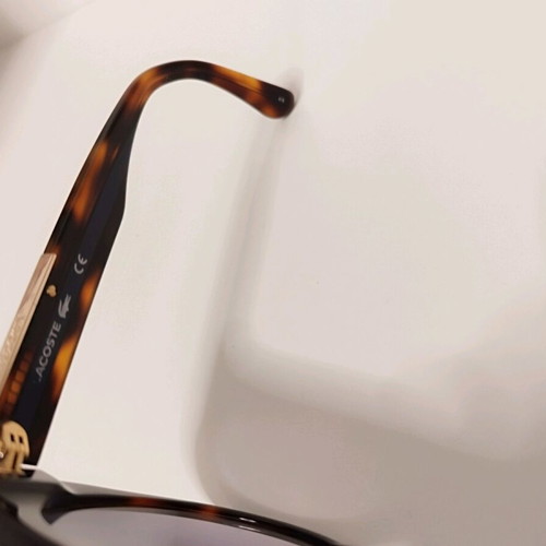 Lacoste tortoise sunglasses like new with blue stripe