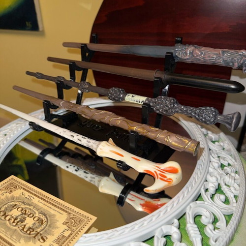 Harry Potter wand set of 5 like new with stand and gilded ticket
