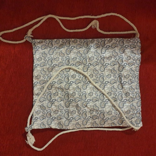 Drawstring backpack with paisley pattern and gold details, new