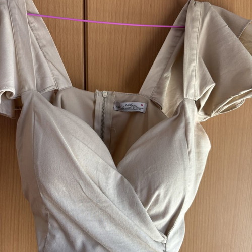 Zark beige top with asymmetric design and built-in bust support