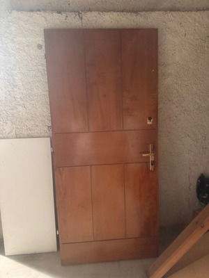 Wooden entrance door used with locks and golden handle